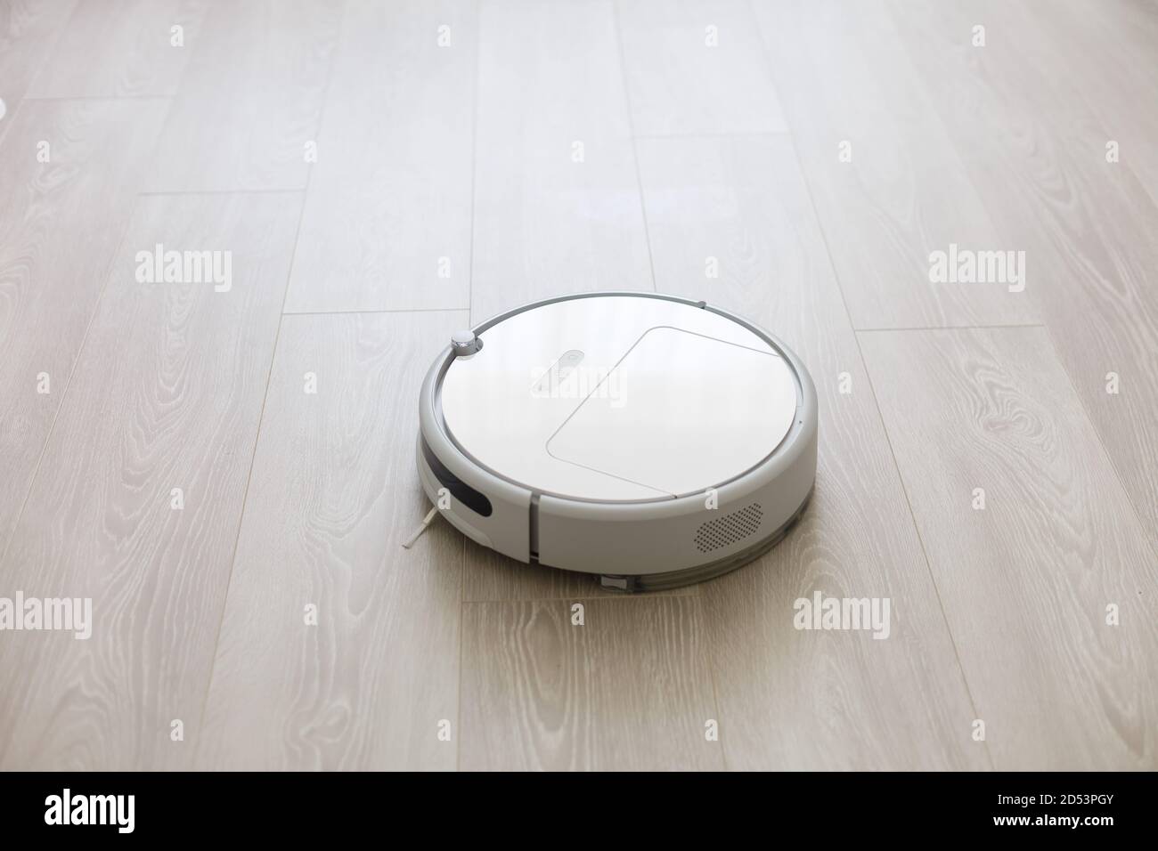 robotic vacuum cleaner on laminate wood floor smart cleaning technology