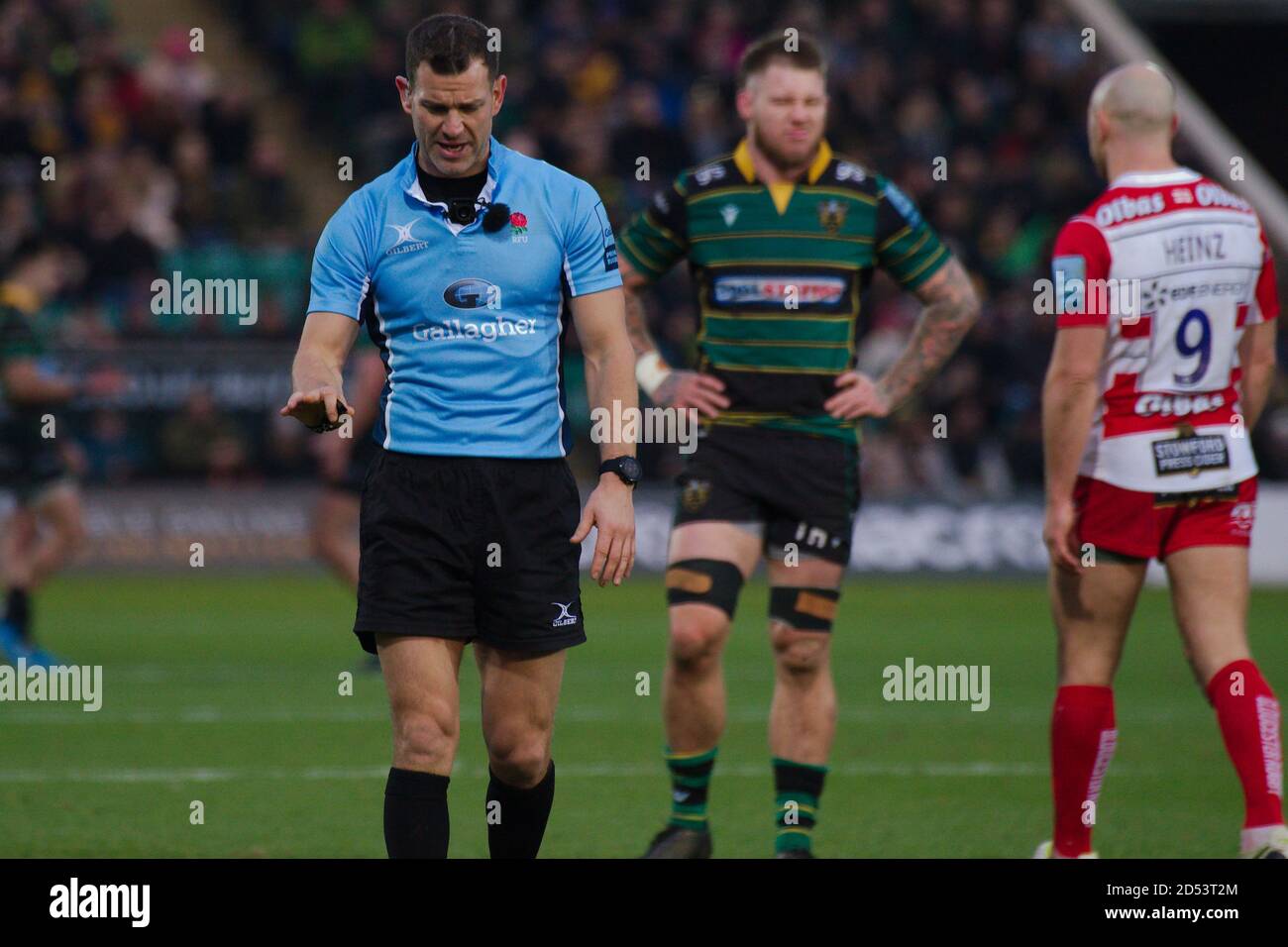 Northampton, England, 28 December 2019. Referee Karl Dickson walking towards the television screen whilst discussing a decision with Television Match Official Sean Davey during the Gallagher Premiership match between Northampton Saints and Gloucester Rugby at Franklin’s Gardens. Stock Photo