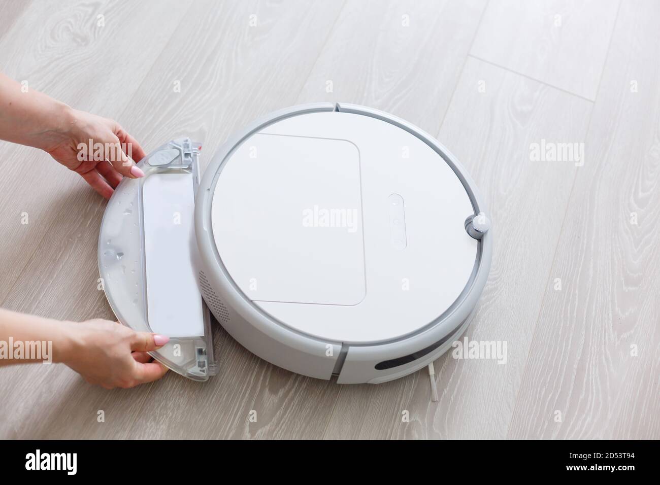 Robotic vacuum cleaner. Container with garbage from a smart robot