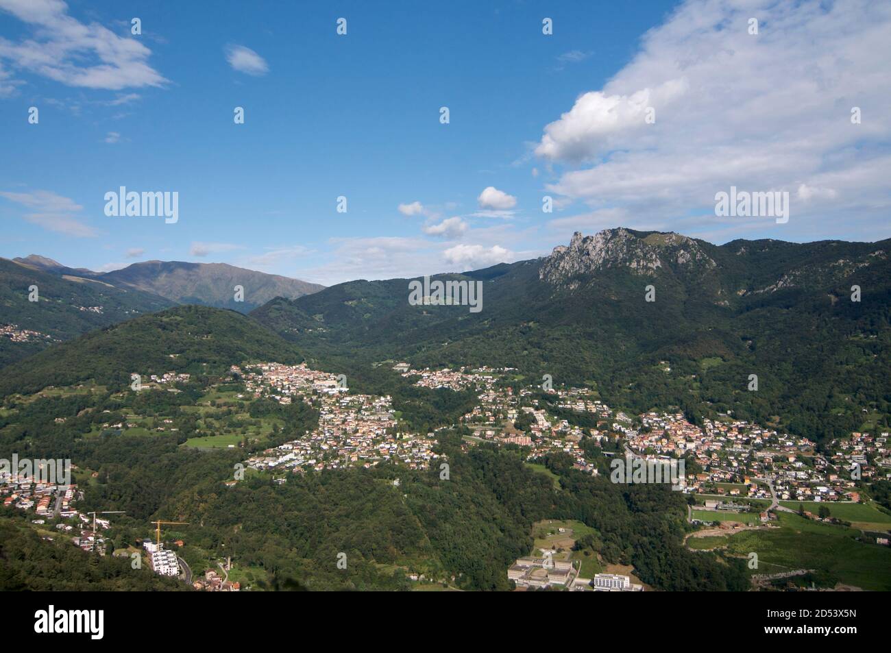 Panoramic view of the villages Tesserete, Lugaggia, Sonvico, Cadro and the Denti della Vecchia mountains located in the Canton Ticino in Switzerland Stock Photo