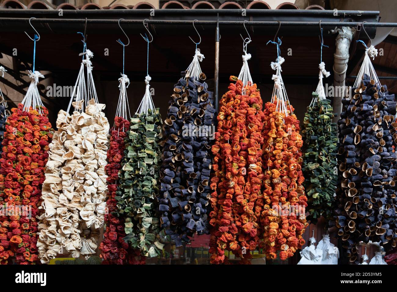 Dried peppers and eggplant hanging in a market Stock Photo - Alamy