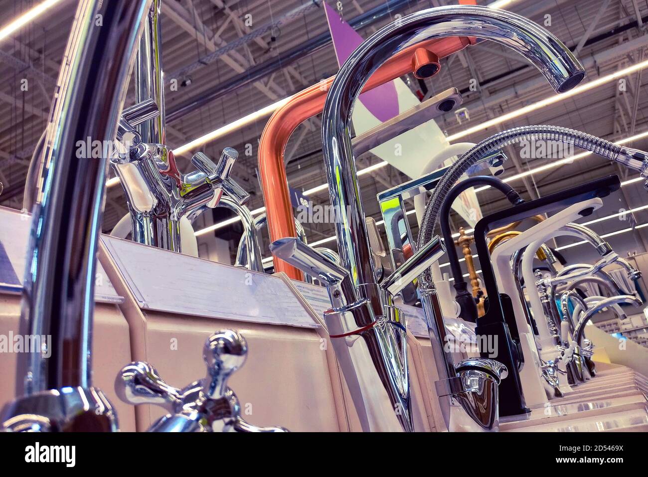 Sale of taps for kitchen and bathroom in the store Stock Photo - Alamy