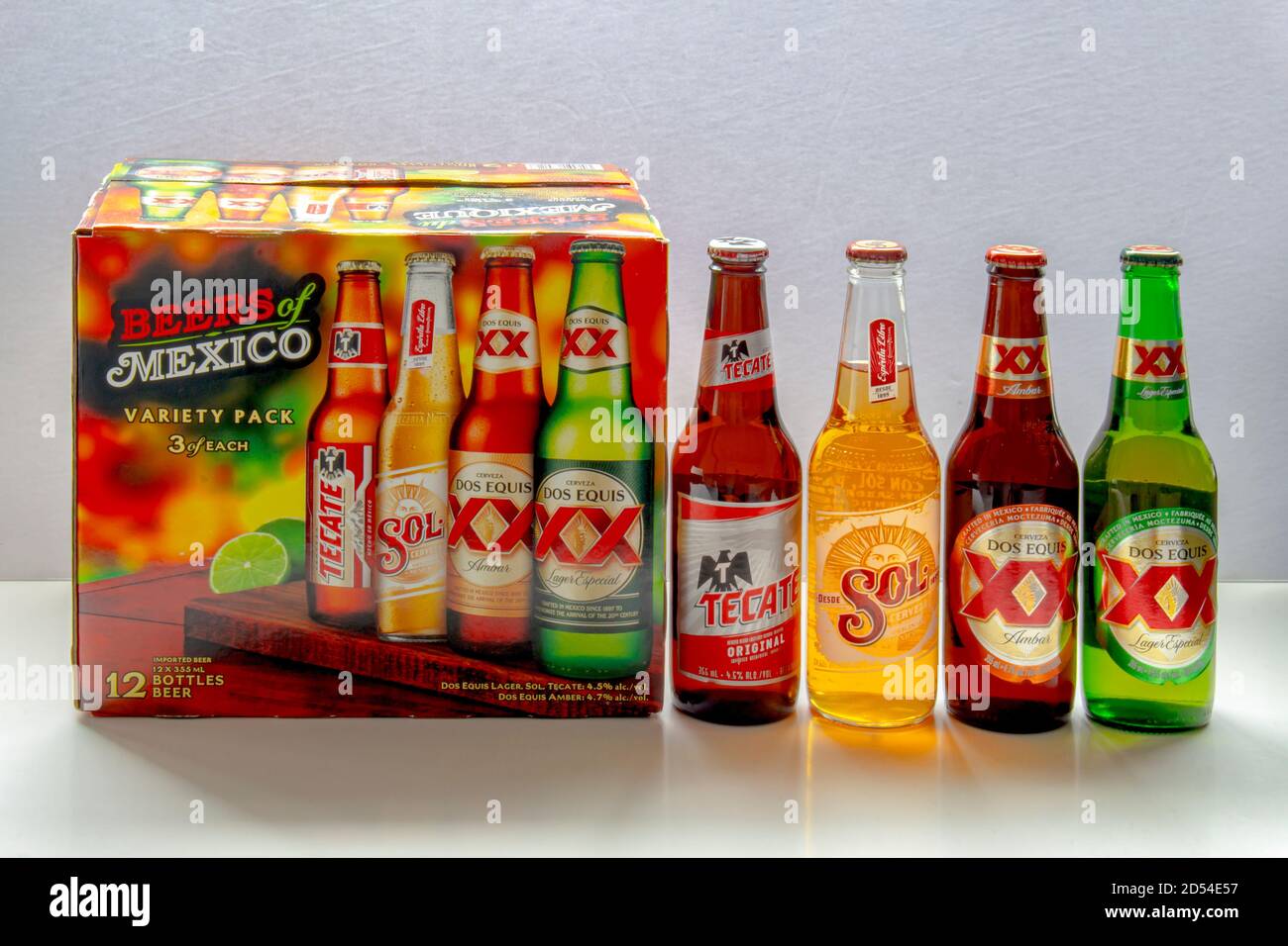 Calgary, Alberta, Canada. Oct 12, 2020. A Beers of Mexico 12 pack box. Tecate, Sol, Dos Equis beer bottles on a white background. Stock Photo