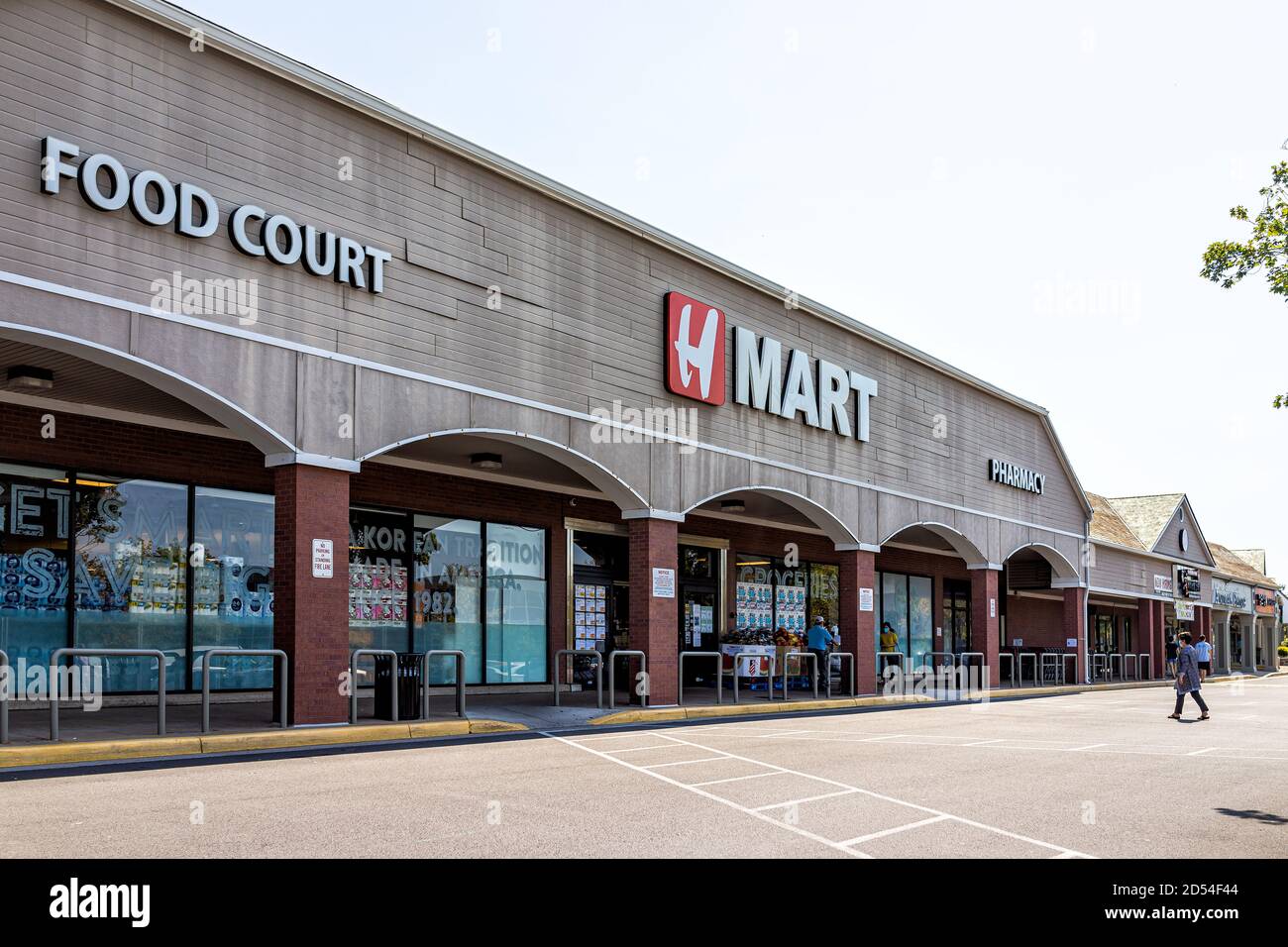 Centreville, USA - September 7, 2020: Hmart asian grocery store facade with Korean people walking entering shop with sign for food court during covid Stock Photo