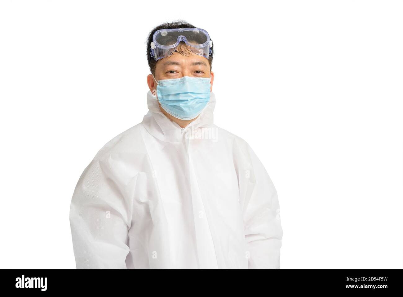 An Asian man wearing a protective suit, protective face masks, and