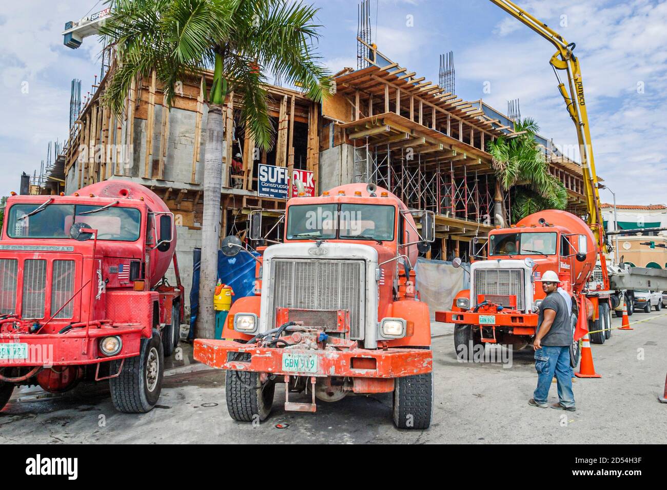 Miami Beach Florida,cement truck trucks lorry lorries concrete mixer,under new construction site building hard hat zone, Stock Photo