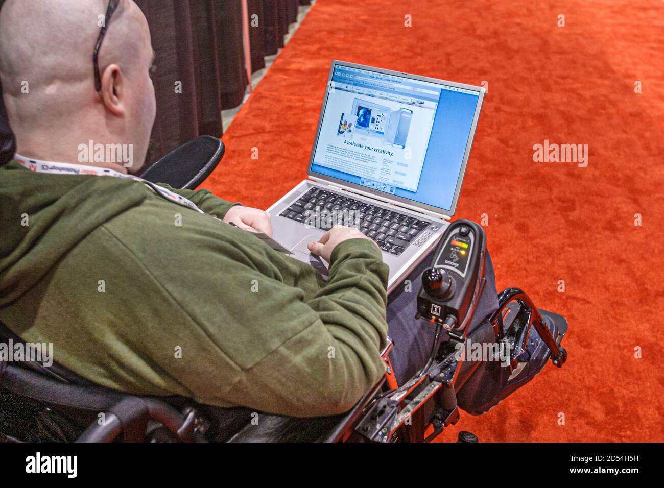 Florida,Miami Beach Convention Center,centre,Photoshop World technology disabled handicapped special needs man male using laptop computer wheelchair, Stock Photo