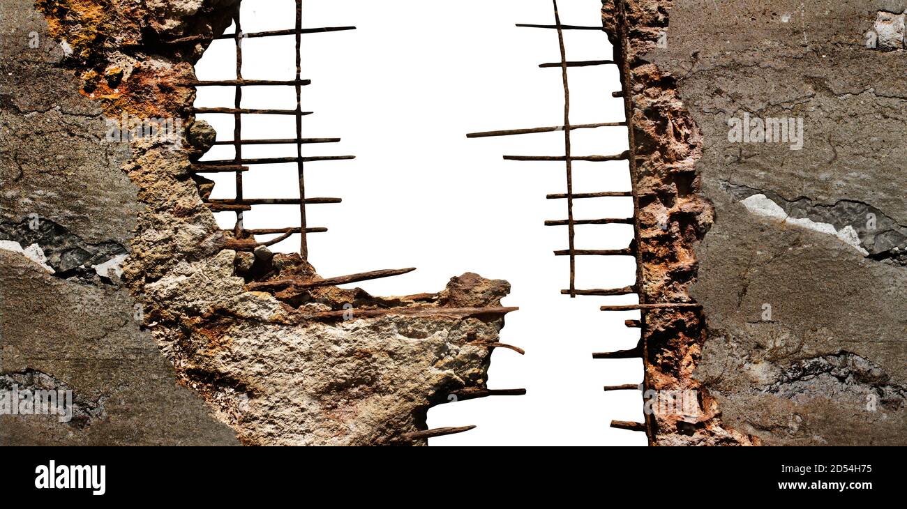 Isolated photo of destroyed concrete wall with rusty metal parts and