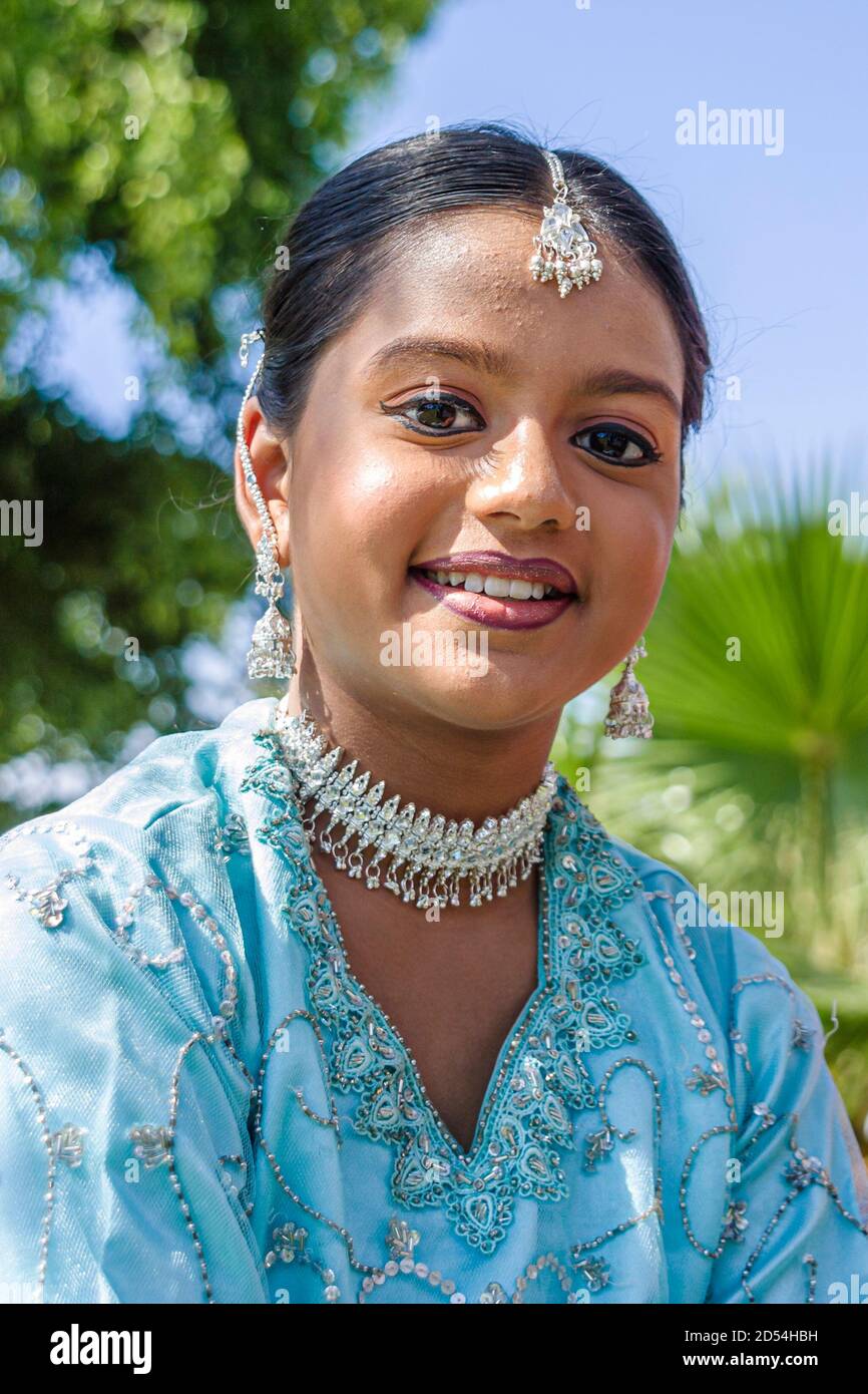Miami Beach Florida,Haulover Park Hong Kong Dragon Boat Festival,Asians teen teenage teenager girl female smiles smiling,wears wearing jewelry jeweler Stock Photo