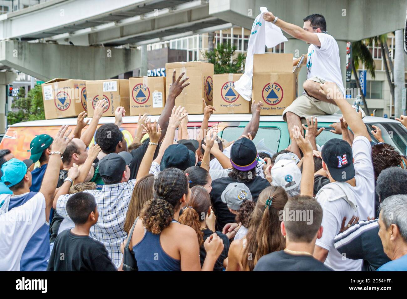 Miami Florida,Flagler Street,Marlins Major League Baseball team World Series winner,fans celebrate celebrating tee shirt shirts giveaway giving away,r Stock Photo