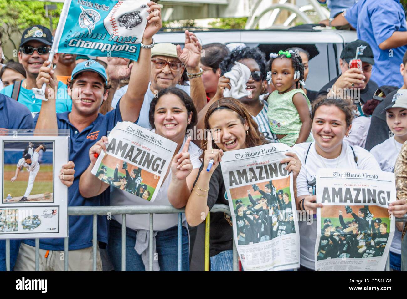 Miami Florida,Flagler Street,Marlins Major League Baseball team World Series winner,fans celebrate celebrating hold holding newspaper headline headlin Stock Photo