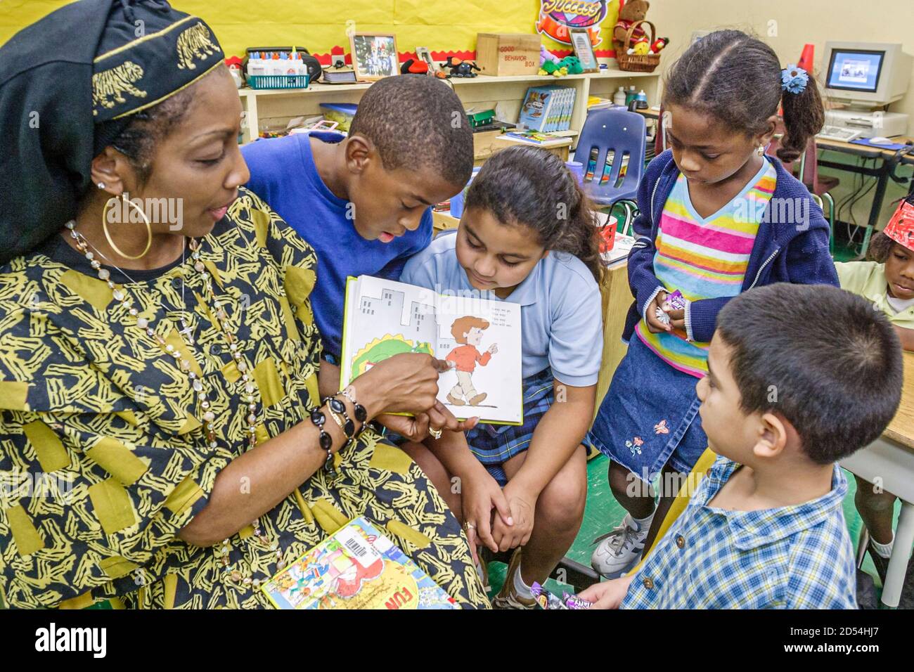 Miami Florida,Overtown,Frederick Douglass Elementary School,teacher dressed outfit,literary costume reading book fictional character,Hispanic Black Af Stock Photo