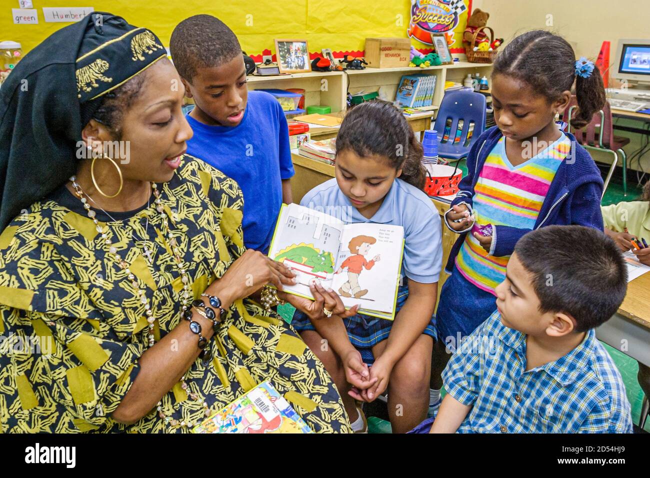Miami Florida,Overtown,Frederick Douglass Elementary School,teacher dressed outfit,literary costume reading book fictional character,Hispanic Black Af Stock Photo
