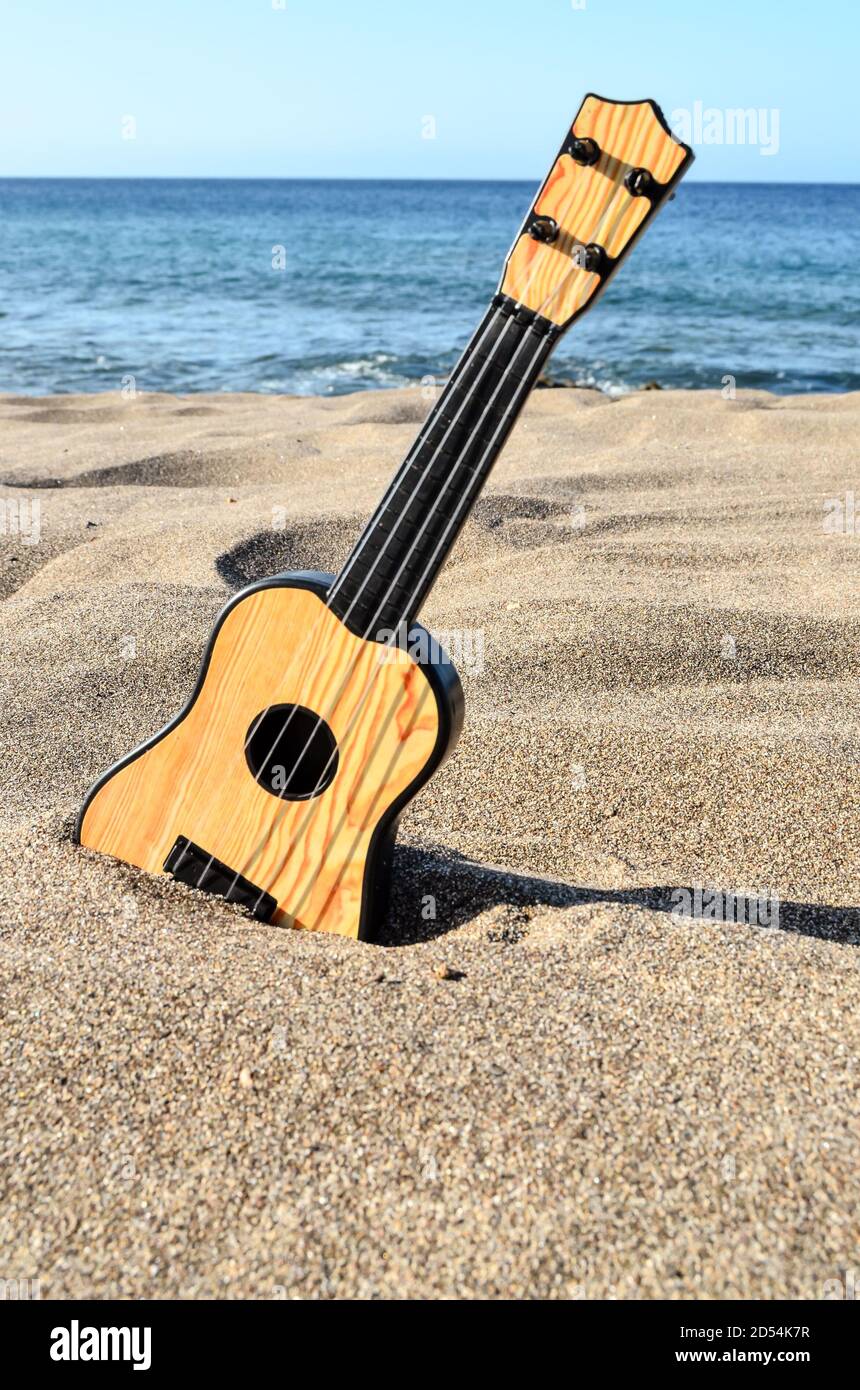 Guitar on the Sand Beach Stock Photo Alamy