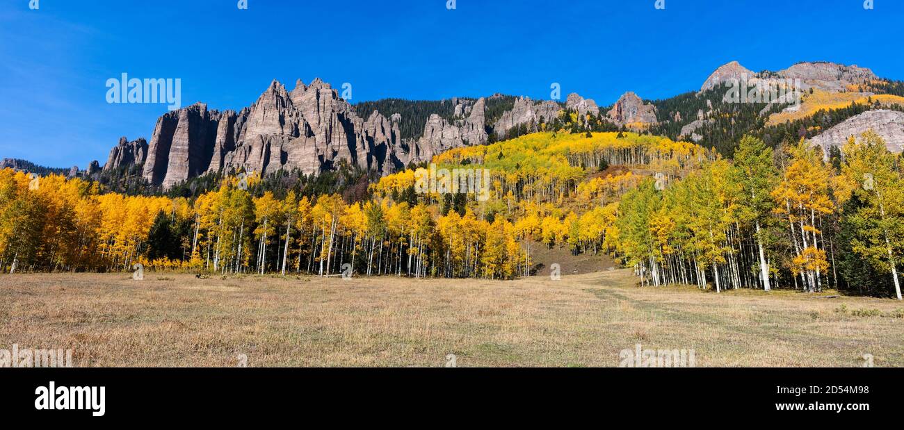 Panorama of a scenic autumn landscape with Aspen trees and vibrant fall colors in the San Juan Mountains near Ridgway, Colorado Stock Photo