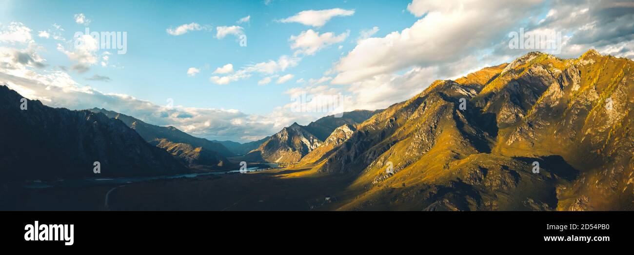 Panoramic shot of beautiful autumn mountain landscape at sunset, aerial view Stock Photo