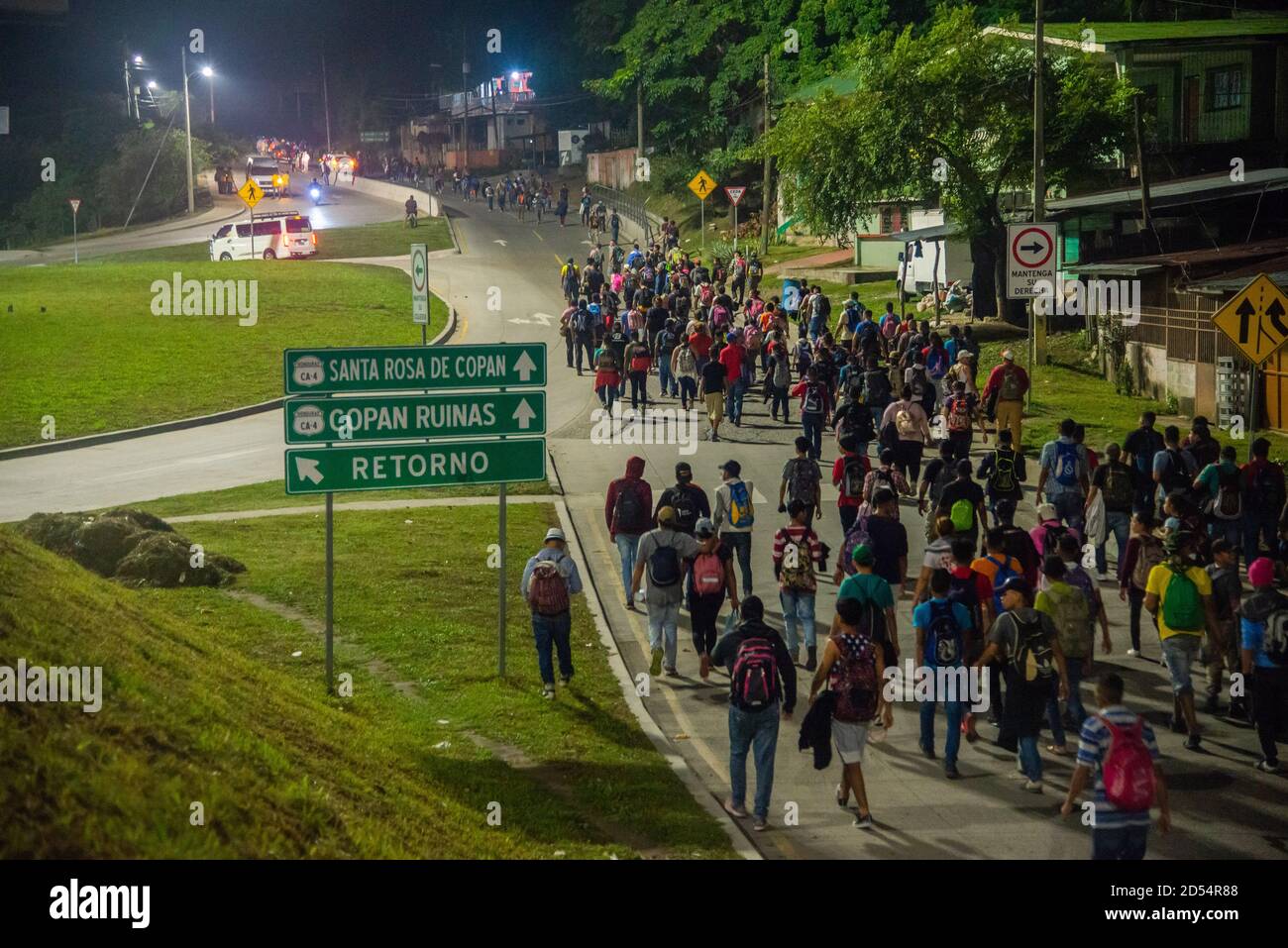 San Pedro Sula, Honduras. 15th Jan, 2020. Migrants walk towards the Guatemalan border at 4am on the first day of their journey to the U.S. border. Migrants are fleeing from extreme poverty and gang violence, hoping to find a better life in the U.S. They must travel over 3,000 miles through Guatemala and Mexico, often times with nothing but the clothes on their back, to reach the border in Tijuana, Mexico where their fate is undecided. Credit: Seth Sidney Berry/SOPA Images/ZUMA Wire/Alamy Live News Stock Photo