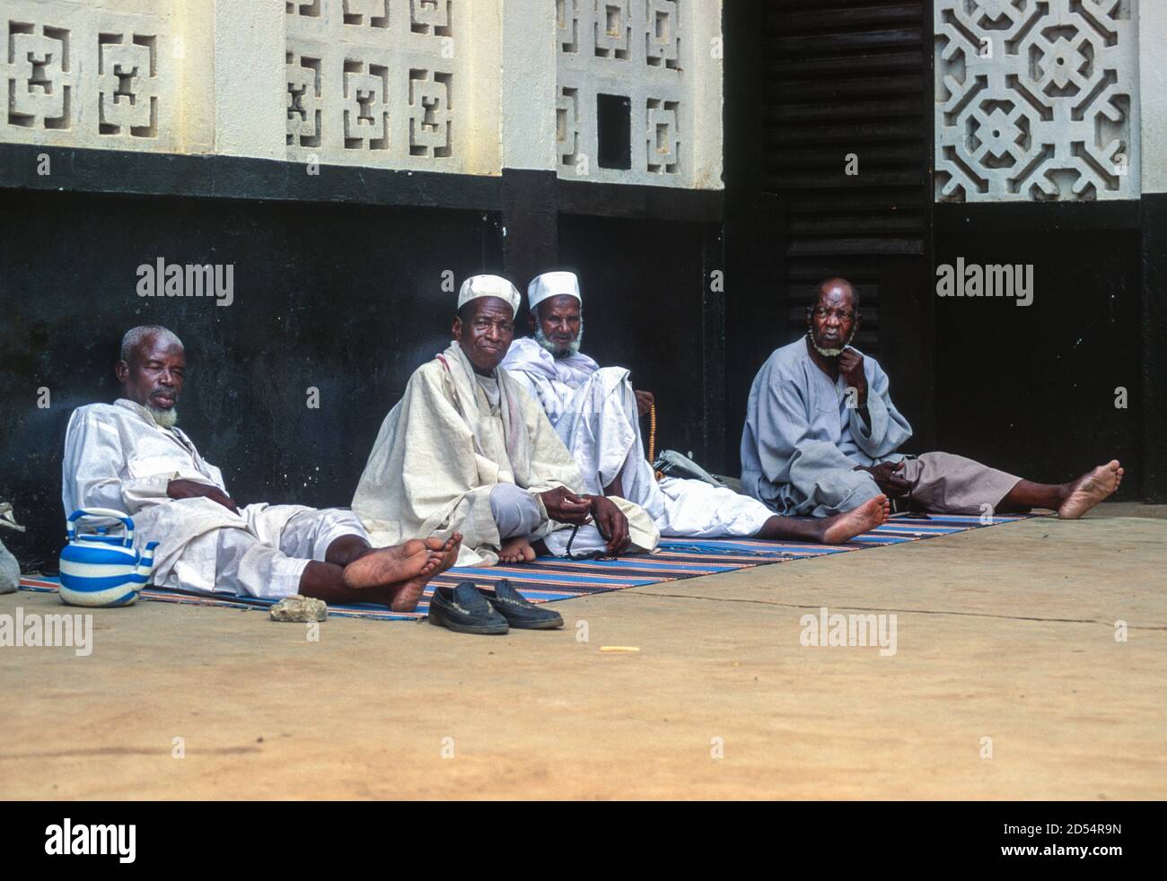 Bouake, Ivory Coast, Cote d'Ivoire. Muslim Ivorian Men Relaxing outside  their Mosque while Waiting for Prayer Time Stock Photo - Alamy