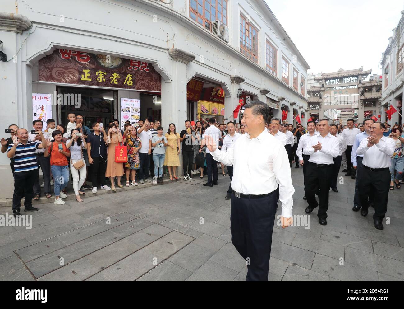 Chaozhou, China's Guangdong Province. 12th Oct, 2020. Chinese President Xi Jinping, also general secretary of the Communist Party of China Central Committee and chairman of the Central Military Commission, waves to people while visiting a street lined with ancient memorial archways in Chaozhou, south China's Guangdong Province, Oct. 12, 2020. Xi on Monday arrived in Guangdong to begin an inspection tour of the province. Credit: Wang Ye/Xinhua/Alamy Live News Stock Photo