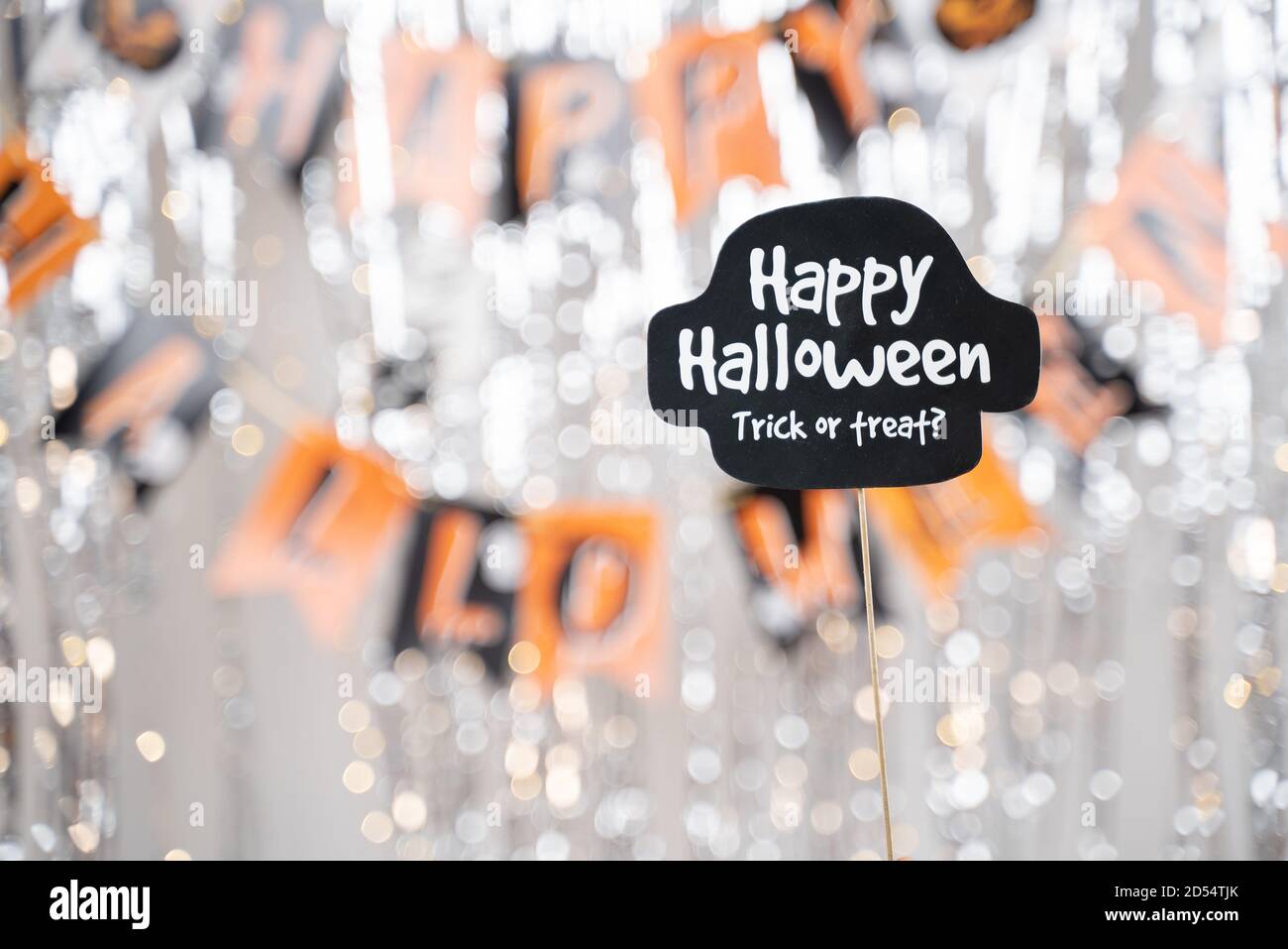 Happy Halloween and trick or treat signage booth prop on decorated background - concept of holiday and halloween festival. Stock Photo