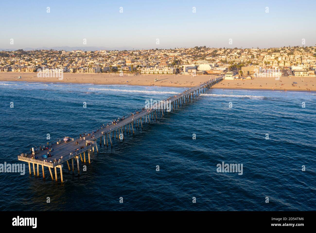 Hermosa Beach pier from the air out over the Pacific Ocean at sunset Stock Photo