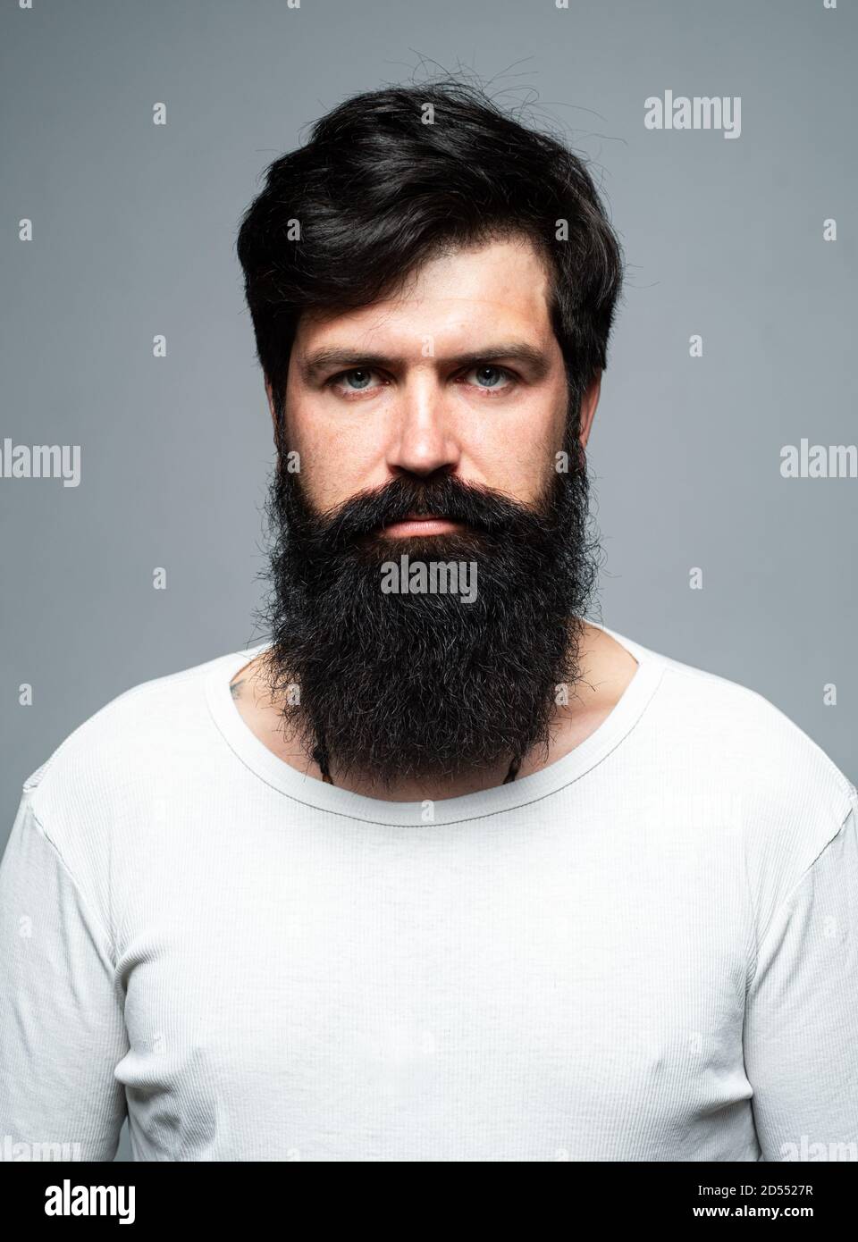 Barber with long beard and moustache in barbershop. Bearded man Stock Photo  - Alamy