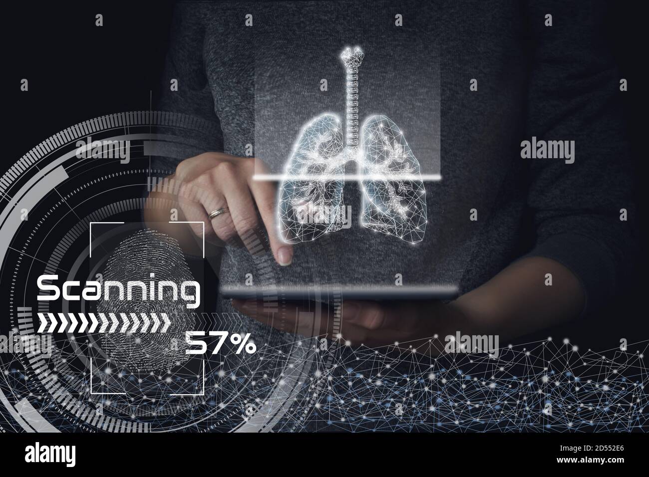 Scanning human lungs on tablet gologram. Dark background. The concept