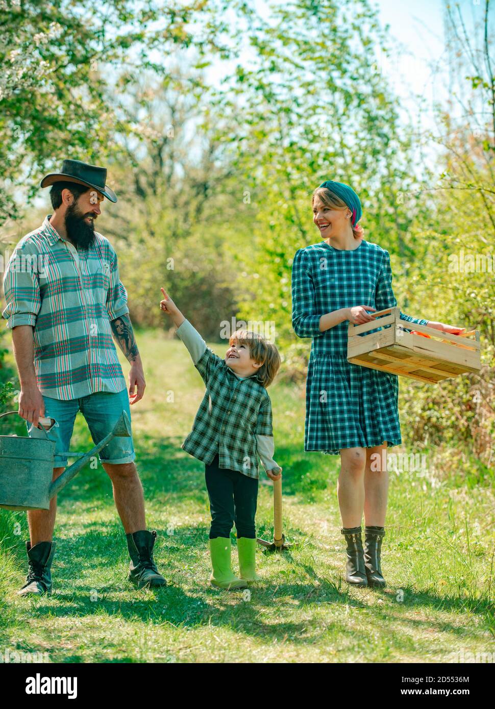 Portrait happy gardeners planting garden hi-res stock photography and ...