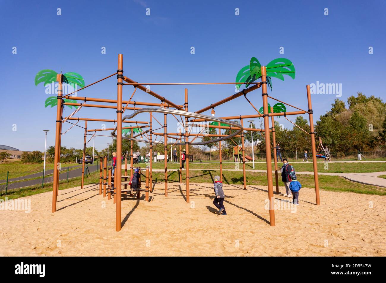 POZNAN, POLAND - Oct 11, 2020: Kids having fun with a zip line equipment on  sand at a new modern playground in the Malta park Stock Photo - Alamy