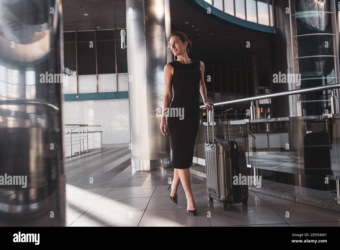 Confident young woman having a business trip Stock Photo