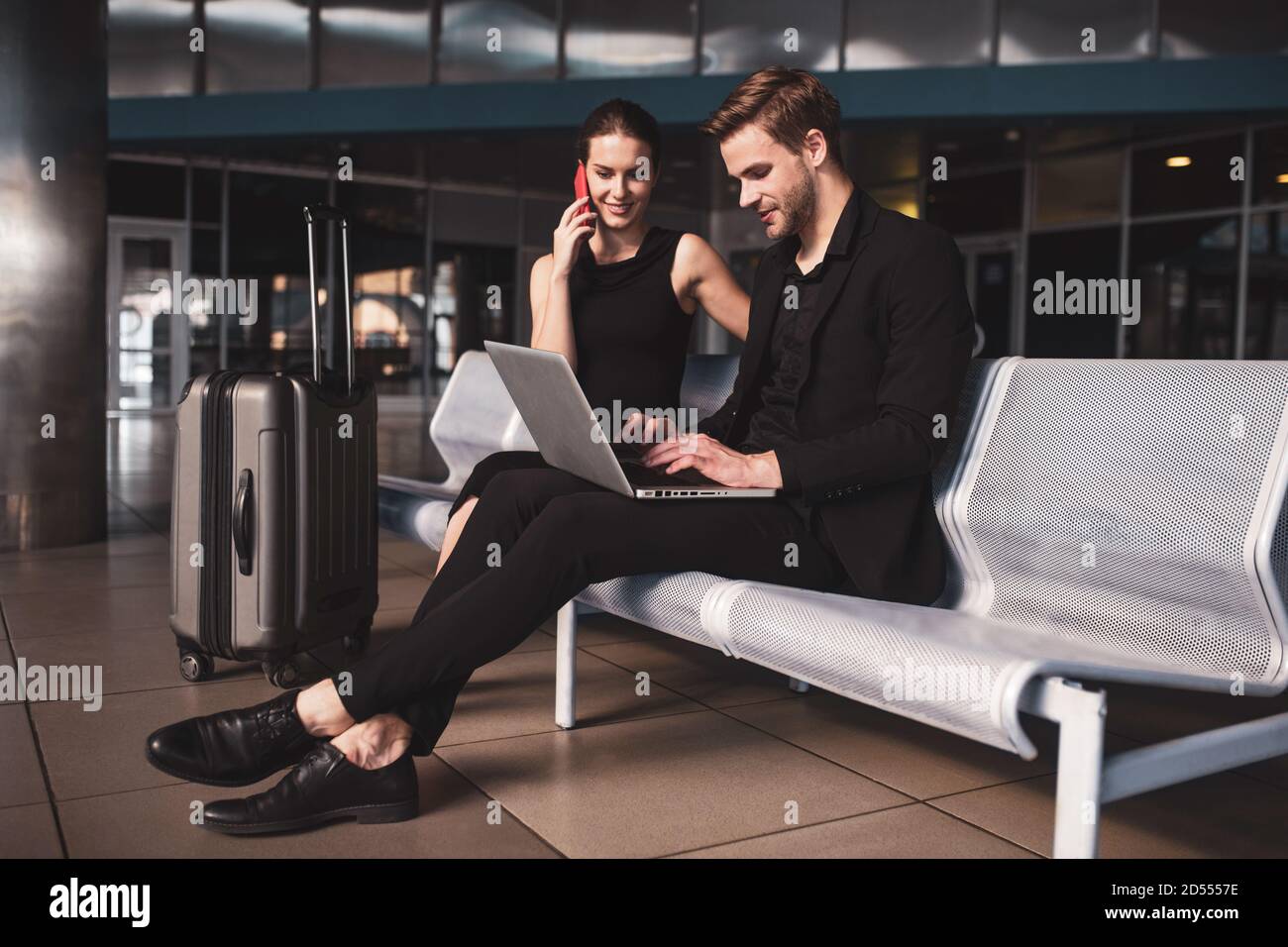 Colleagues completing their work while having a business trip Stock Photo