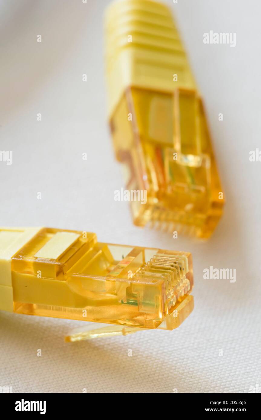 Yellow LAN cable plugs for communication Stock Photo Alamy