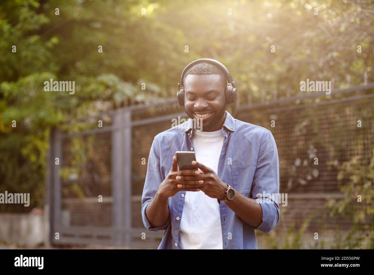 Young black man walking afro hi-res stock photography and images - Alamy