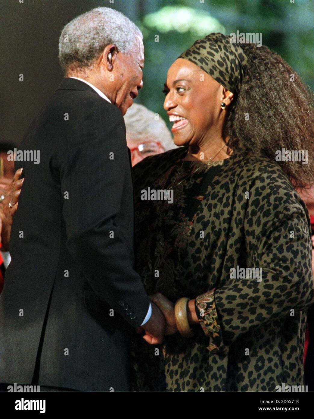 South Africa's President Nelson Mandela hugs opera diva Jessye Norman after she sang an a cappella version of "Amazing Grace" honor of the during specially convened ceremonies Mandela September
