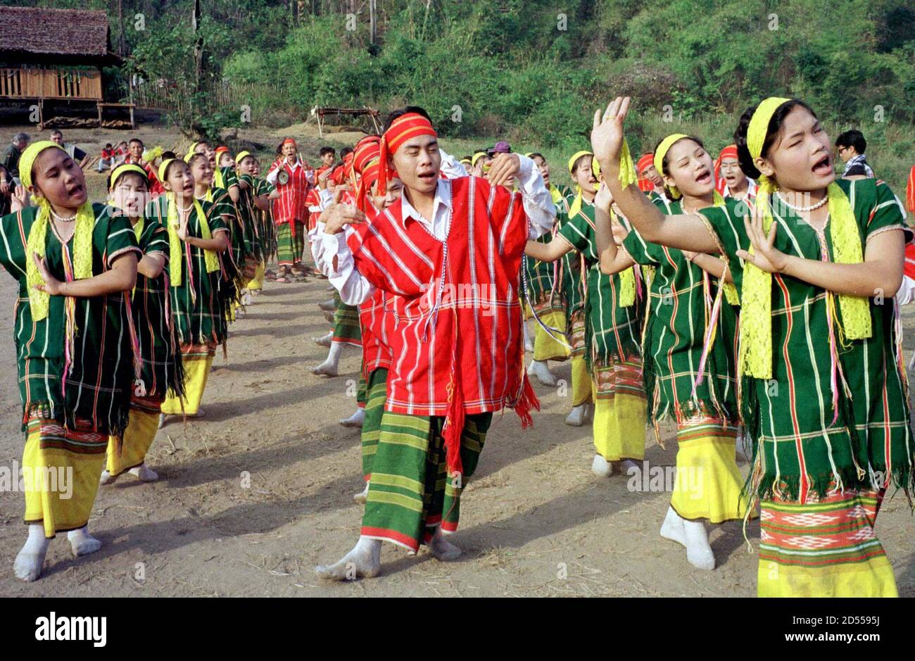 Traditional Karen dancers perform during the celebrations of the Karen National Union (KNU) 50th year of fighting for an autonomous state in the [military] base of Tadoh Thutan on the bank of the Moei river in eastern Myanmar January 31. The KNU is one of the only ethnic groups in Myanmar that has not entered into a ceasefire agreement with the SPDC (State Peace and Development Council, formerly SLORC) [military] regime in Yangon. Stock Photo