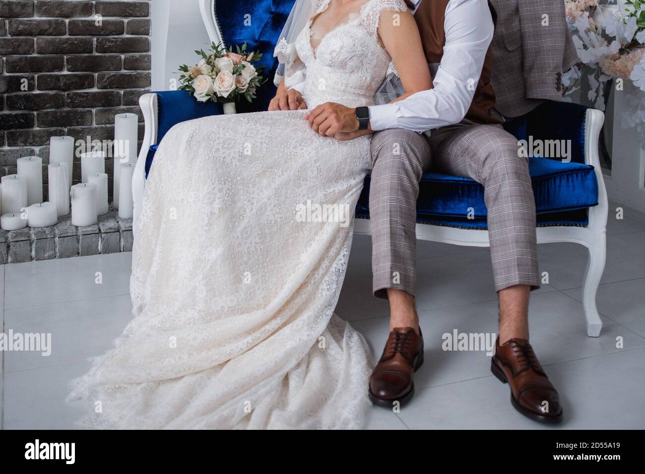 the groom and the bride sit together in chair Stock Photo - Alamy