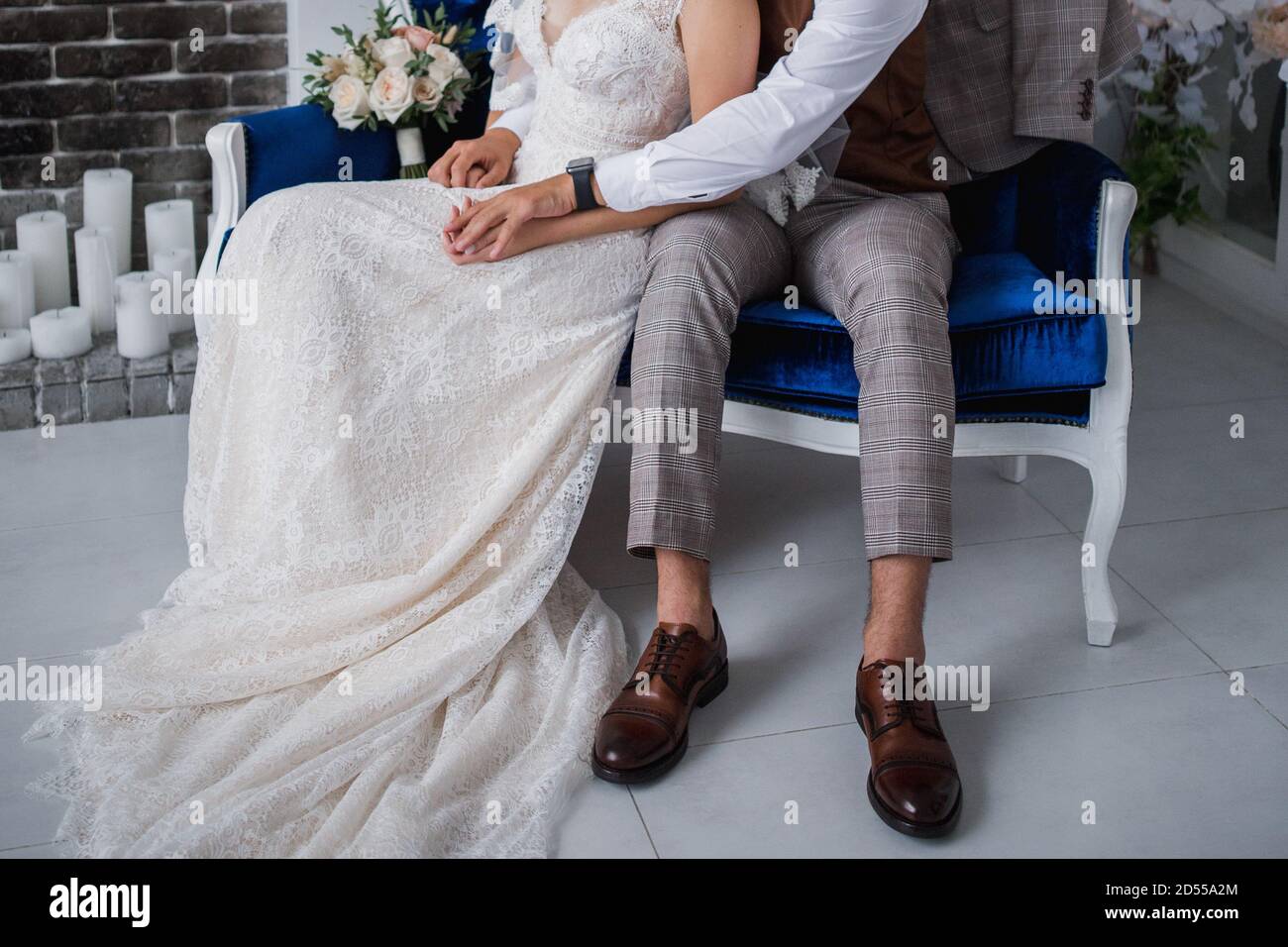 the groom and the bride sit together in chair Stock Photo - Alamy