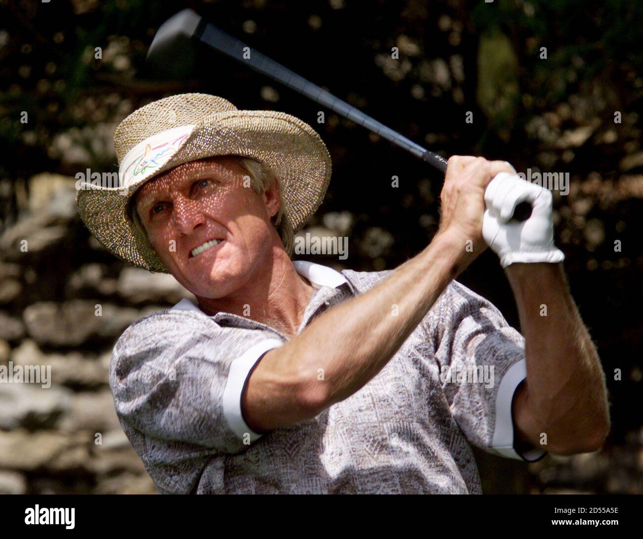 Greg Norman drives off the second tee 