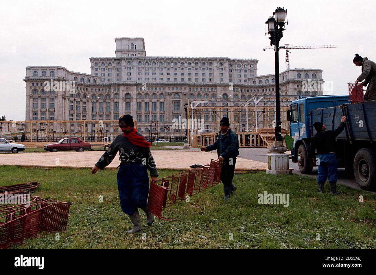 Romanian workers prepare the grounds of the vast marble palace erected by commnunist dictator Nicolae Ceausescu, for a Roman Catholic outdoor mass, in Bucharest May 6, one of the high points of Pope John Paul's visit to Romania. The pope's visit, the first ever to a mainly Orthodox country, is intended to improve relations between the Catholic and Orthodox church, split since the 11th century.  BC/WS Stock Photo