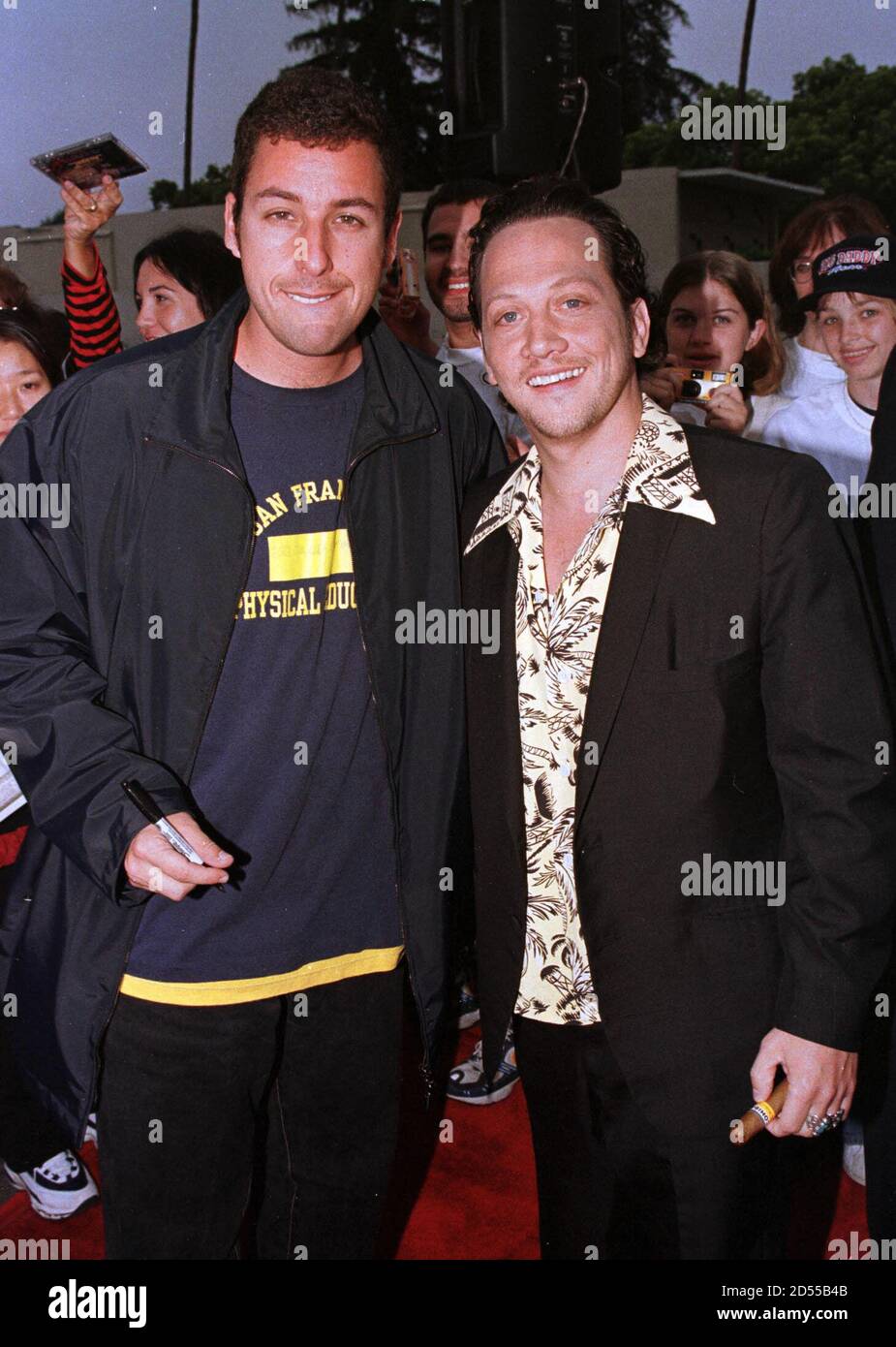 Actors Adam Sandler (L) and Rob Schneider stars of the new comedy film "  Big Daddy" pose together June 17 in Los Angeles. The film stars Sandler as  a 32-year-old who tries