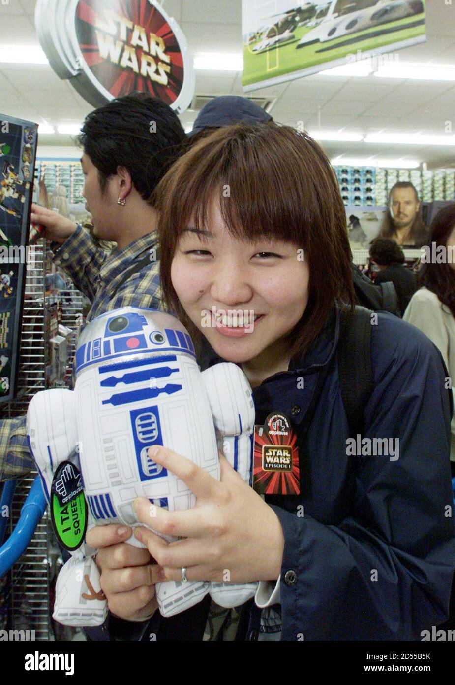 A Japanese Star Wars Fan Holds The Star Wars Toy Robot R2d2 As She Purchases It At A Toy Store In Tokyo June 19 Star Wars Merchandise Hit Japanese Store Shelves Today