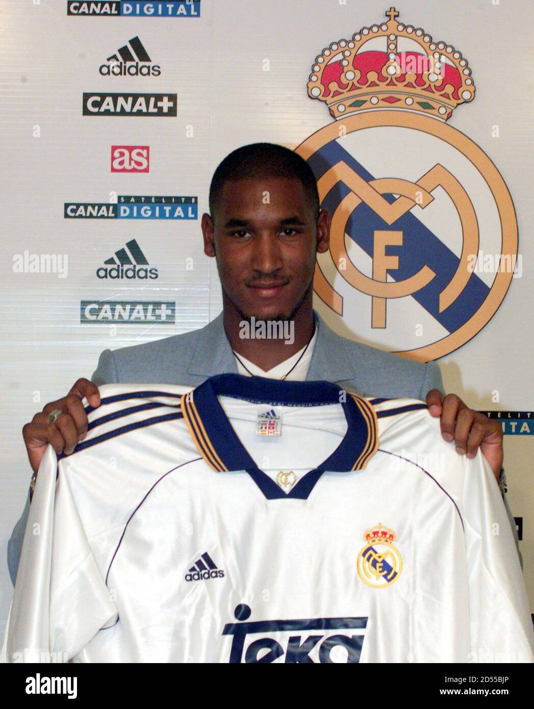 French soccer star Nicolas Anelka up Real Madrid's shirt after his presentation former European Champions new player at Santiago Bernabeu stadium August 5. Anelka's tranfer from English Premier League club