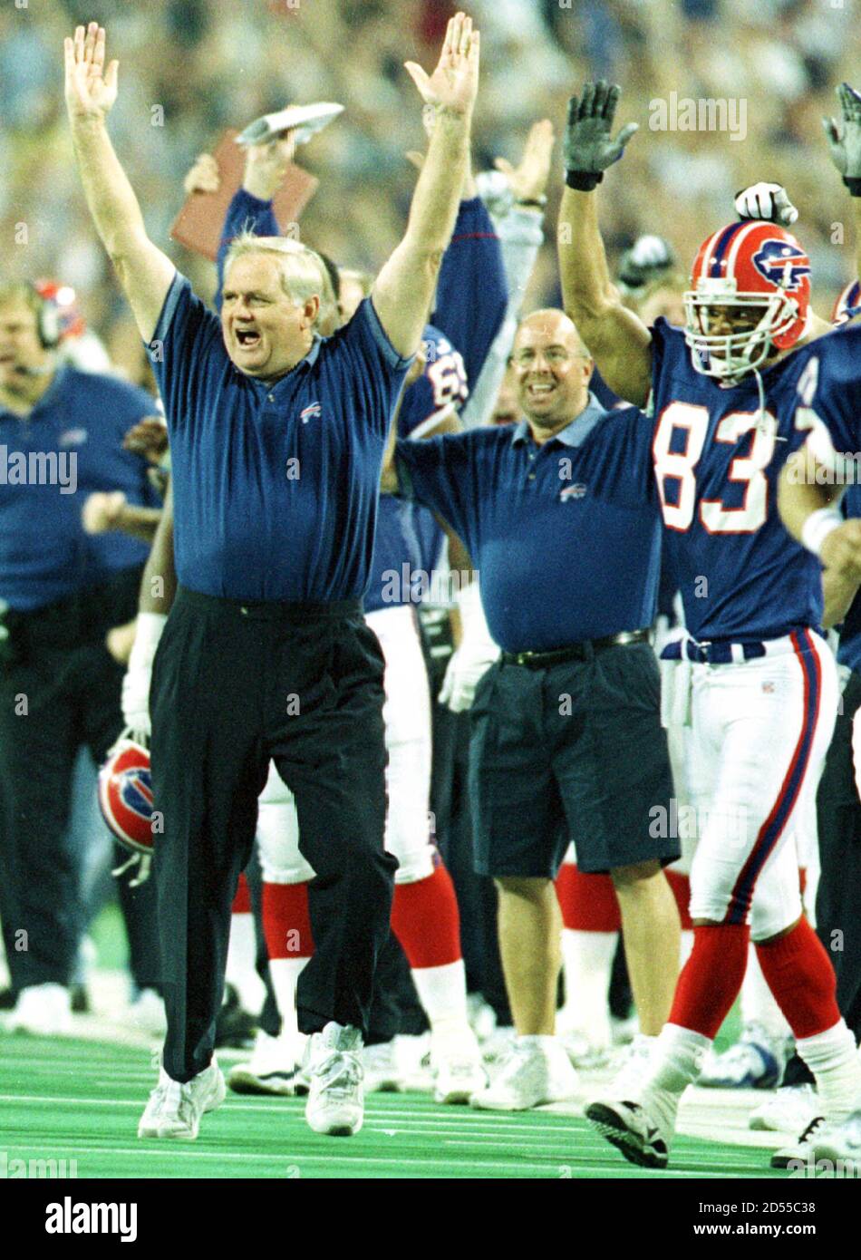 Buffalo Bills head coach Wade Phillips cheers with wide receiver Andre Reed  (83) as the Bills make their final score over the New York Jets at the  Ralph C. Wilson Stadium in