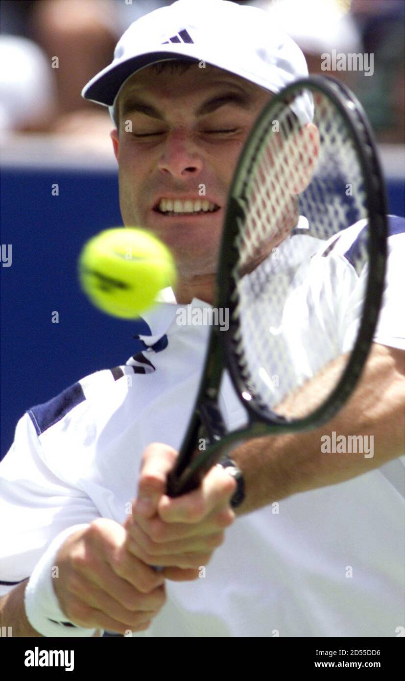 Chris Woodruff of United States hits a abackhand return to Tim Henman of  Great Britain at the Australian Open in Melbourne January 23. Woodruff won  the fourth round mach in five sets