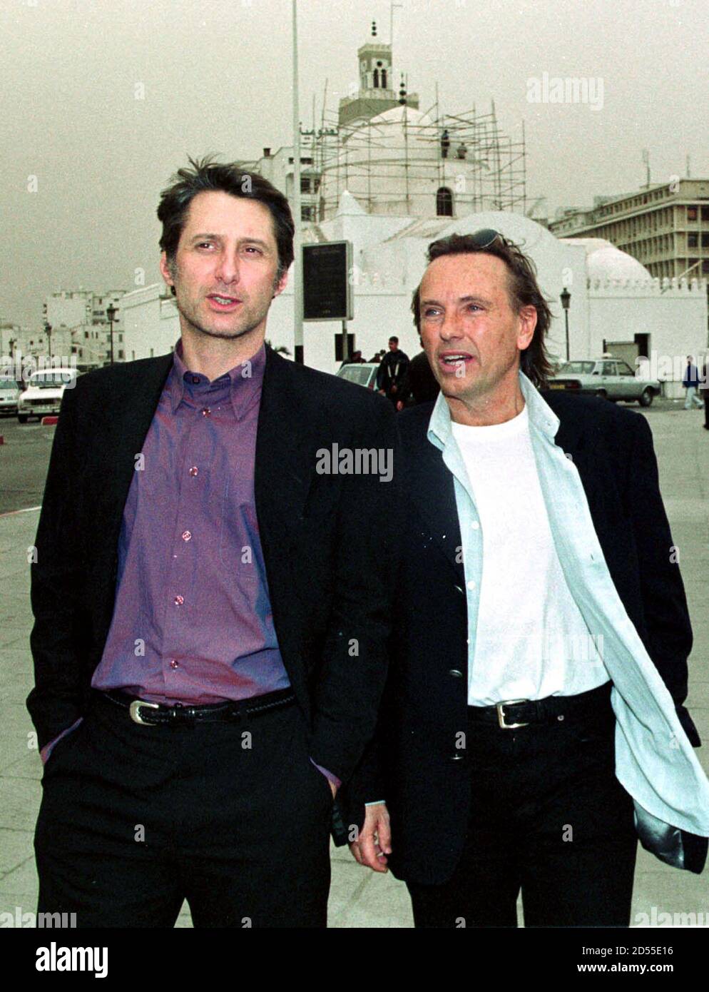French director Alexandre Arcady (R) and actor Antoine de Caunes (L)  discuss on the Place des Martyrs in Algiers April 8. Arcady de Caunes are  in Algiers for the first screening of