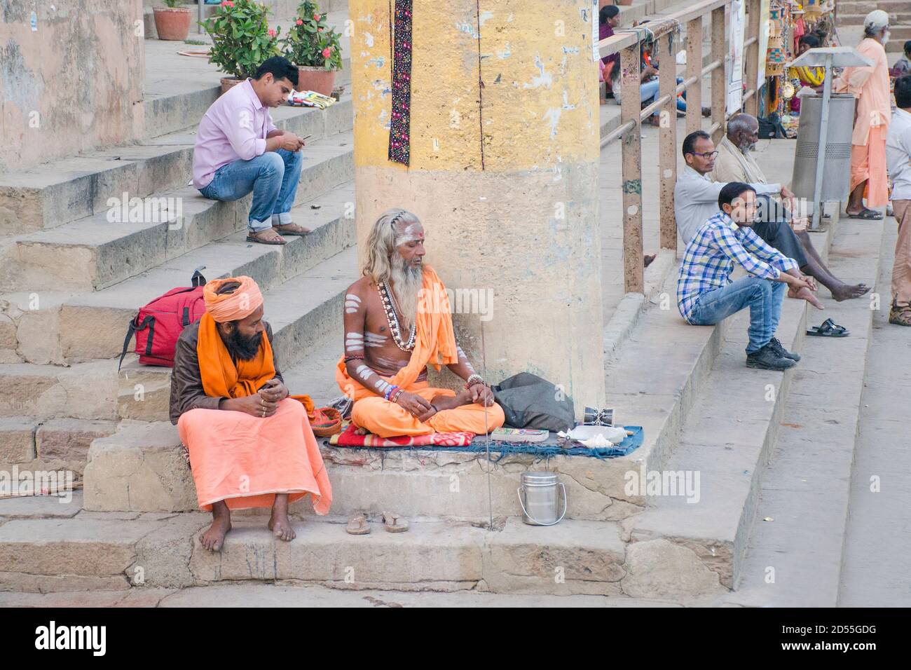 varanasi uttar pradesh india on march 3rd 2017:Two saints are sitting at Varanasi Ganga Ghat. Stock Photo