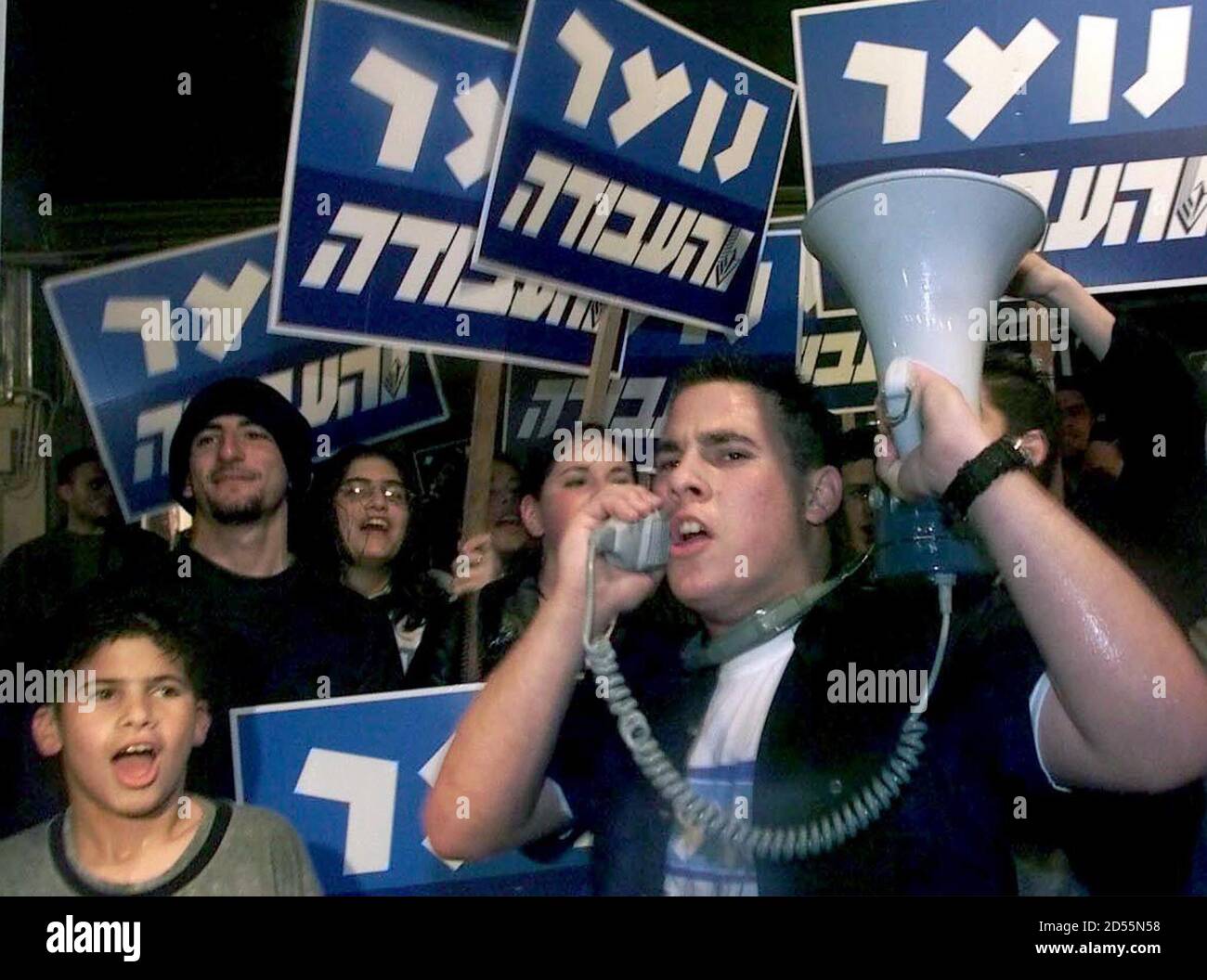 Young supporters of the Israeli group "Peace Now" demonstrate in Tel Aviv's Rabin Square in support of Israeli Prime Minister Ehud Barak during his peace talks with Syrian Foreign Minister Farouq al-Shara in Washington, January 3. Under a law passed in January, 1999, Barak must submit any deal on the Golan to a public referendum and a special parliamentary majority is also needed to give back the land. Syria's core demand is that Israel withdraw in full from the Golan heights to the borders in place on the eve of the 1967 war. Israel wants to see a core agreement - a framework for a later peac Stock Photo