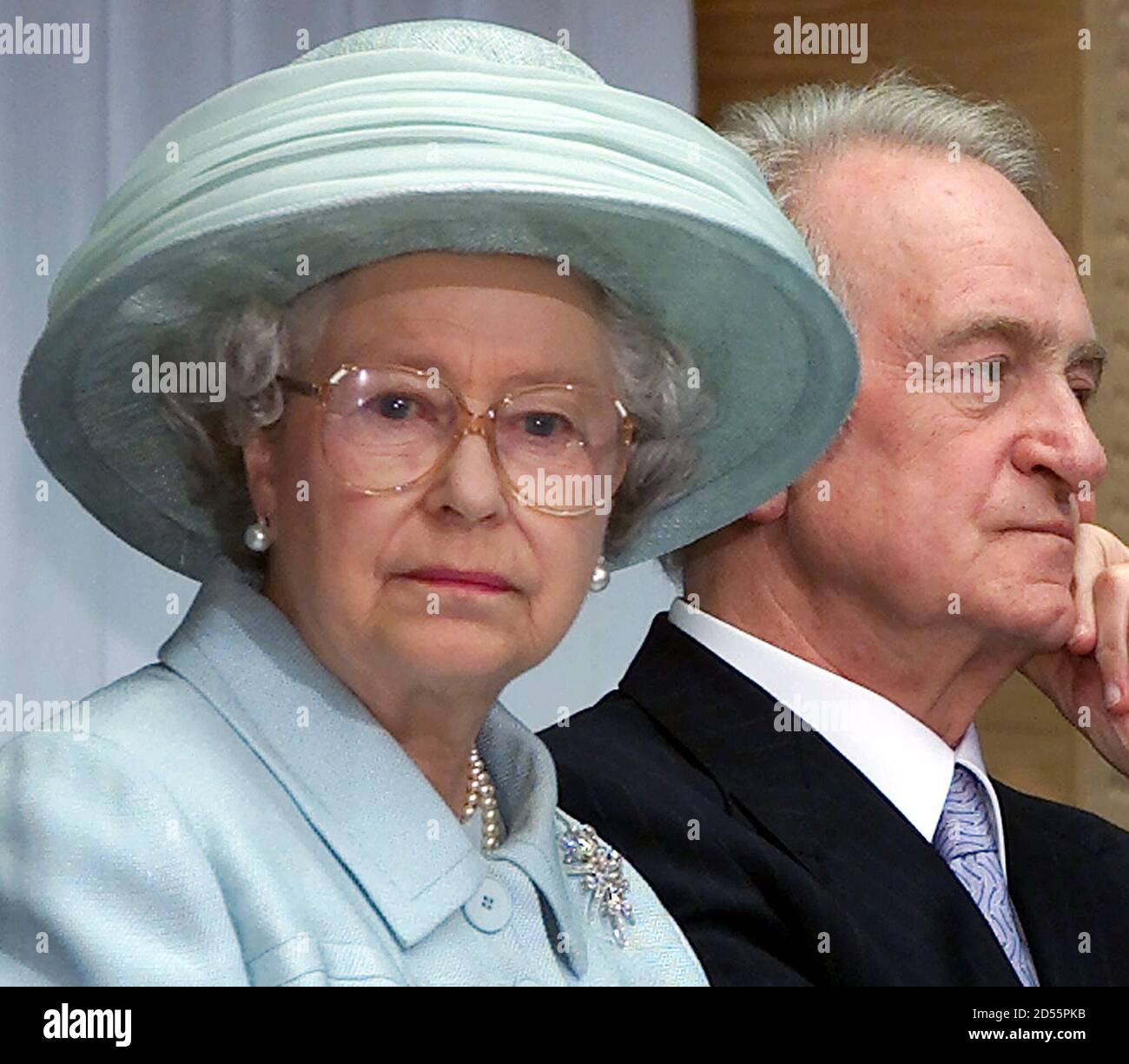 British Queen Elizabeth (L) is accompanied by German President Johannes Rau (C) as she attends the opening ceremony of the new British embassy in Berlin July 18. The new embassy, designed by British architect Michael Wilford, is based on the same site as the old building which was destroyed by Allied bombers in World War Two.  MUR Stock Photo