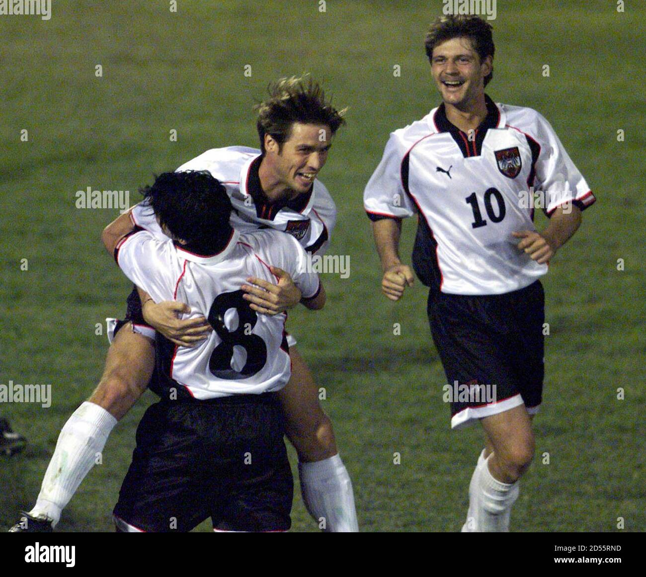 Austria's Harald Cerny (top) celebrates his goal as he jumps at Didi Kuehbauer while their teammate Haqnnes Reinmayr (R) looks on during their Euro 2000 qualifying match against Cyprus October 10.  LE/JDP Stock Photo