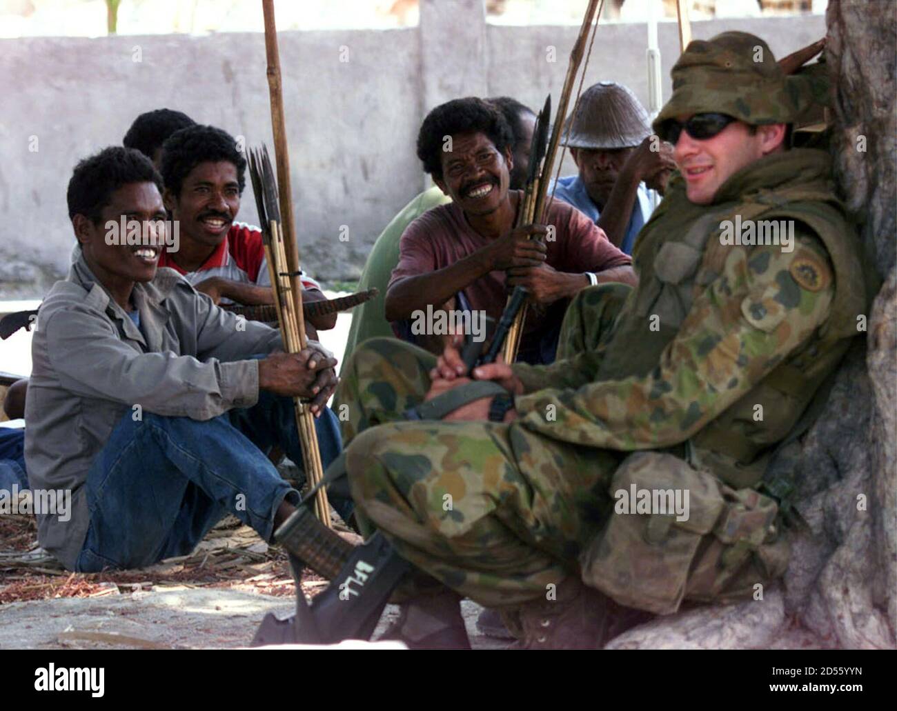 Australian Soldiers Chat With Villagers Armed With Bows And Arrows In  Manatuto, A Village 50 Kilometres East Of Dili September 25, As The  Australians Escort A Damage And Aid Assesment Convoy From